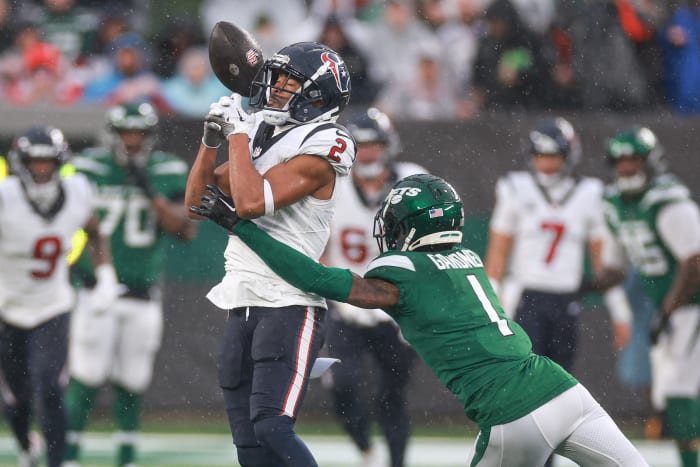 Dec 10, 2023; East Rutherford, New Jersey, USA; New York Jets cornerback Sauce Gardner (1) breaks up a pass intended for Houston Texans wide receiver Robert Woods (2) during the first half at MetLife Stadium. Mandatory Credit: Vincent Carchietta-USA TODAY Sports